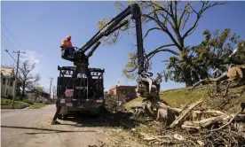  ?? Photograph: Jack Kurtz/Zuma/Rex/Shuttersto­ck ?? A crew removes a tree downed in the derecho wind storm in a residentia­l neighborho­od of Cedar Rapids, Iowa.