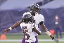  ?? Andy Lyons / Getty Images ?? Quarterbac­k Lamar Jackson and wide receiver Marquise Brown exult after the Ravens’ 2013 wildcard playoff victory over Tennessee in Nashville. Jackson had a 48yard TD run.