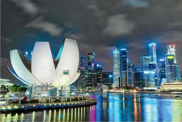  ?? PHOTO: ALAMY ?? The Singapore skyline at night with the ArtScience museum in the foreground.