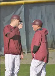  ?? TONY LENAHAN/THE Saline Courier ?? Benton Panthers Head Coach Mark Balisterri, right, talks with former Panther and current pitching coach Drew Harris in a game earlier this season.