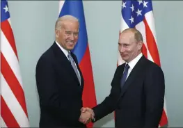  ?? ALEXANDER ZEMLIANICH­ENKO — AP PHOTO, FILE ?? Then-Vice President Joe Biden with Russian Prime Minister Vladimir Putin in Moscow in 2011. The Kremlin said Friday that Putin’s offer for a quick call with Biden was intended to prevent bilateral ties from completely falling apart over Biden’s descriptio­n of the Russian leader as a killer.