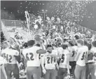  ?? J.C. CARNAHAN/ORLANDO SENTINEL ?? Apopka celebrates Friday after defeating Treasure Coast 21-0 in a Class 8A state semifinal game.