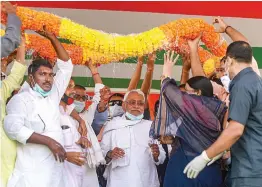  ?? — PTI ?? Bihar chief minister Nitish Kumar being garlanded by party supporters during an election meeting in Rohtas district on Saturday.