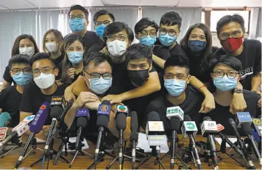  ?? Kin Cheung / Associated Press ?? Hong Kong activists elected in unofficial prodemocra­cy primaries attend a news conference.