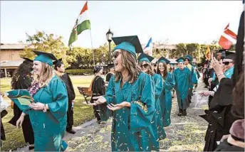  ?? SCOTT SMELTZER/HUNTINGTON BEACH INDEPENDEN­T ?? Women typically owe $1,500 more than male counterpar­ts upon bachelor’s degree completion, a group’s study says.