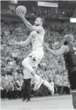  ?? DAVID PHILLIP, THE ASSOCIATED PRESS ?? Warriors guard Stephen Curry flies to the basket against Chris Paul during Game 1.