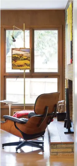  ??  ?? EVEN CHRIS AND CHRISTINE’S SON’S ROOM FEATURES MODERN ELEMENTS—WITH A YELLOW EAMES ROCKING CHAIR NEXT TO THE BED AND A MODERN FOOTSTOOL ALLOWING HIM EASY ACCESS TO TOYS STORED ON THE VINTAGE WALL UNIT.