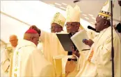  ?? PICTURE: TIMOTHY BERNARD ?? CONFERRING HOLY ORDERS: Archbishop Buti Tlhagale ordains vicar-general Duncan Tsoke as auxiliary bishop of Joburg at a ceremony at Sacred Heart College on Saturday.