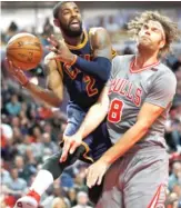  ?? NAM Y. HUH/AP ?? Robin Lopez (right) feels Kyrie Irving’s presence in 2017 during a Bulls home win on TNT.