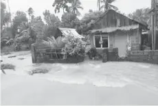  ?? (Joe Louis Gajutos photo) ?? A house in Mapanas, Northern Samar is submerged in flooding due to rains brought by Typhoon Bising, April 18, 2021.