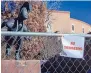  ?? EDDIE MOORE/JOURNAL ?? A chain-link fence and “No Trespassin­g” signs at the Roundhouse on Tuesday.