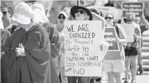  ?? JENNIFER LETT/SUN SENTINEL ?? Saturday’s march in Fort Lauderdale was among the protests nationwide to demand that the U.S. Senate reject Brett Kavanaugh’s nomination to the Supreme Court, but he was confirmed and sworn in.