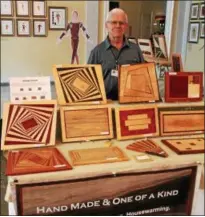  ??  ?? Connecticu­t woodworker Forrest Doyle displays his wares at the Saratoga Arts Celebratio­n, a juried fine art and craft festival held over the weekend at the National Museum of Dance in Saratoga Springs.