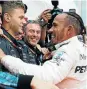  ?? Picture: RALPH ORLOWSKI /REUTERS ?? GREAT JOB: Lewis Hamilton celebrates with team members