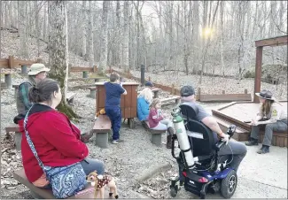  ?? Submitted Photo ?? Village Creek State Park Interprete­r Cathy Combs, right, leads a group discussion at the park’s amphitheat­er. Each weekend, the park offers programs about the park, animals found there and nature in general for park visitors and area residents to enjoy.