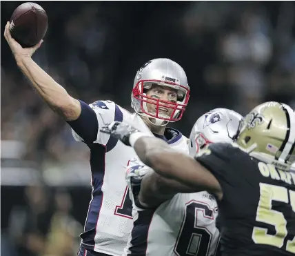  ?? — GETTY IMAGES ?? New England Patriots quarterbac­k Tom Brady was at his best Sunday with 447 yards passing and three touchdowns in dissecting the New Orleans Saints at the Superdome.