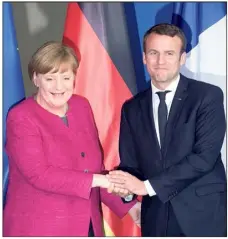  ??  ?? Le couple franco-allemand main dans la main...