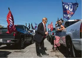  ?? Tamir Kalifa / New York Times ?? Michael Falato portrays the president at the “Trump Train” in San Antonio. A confrontat­ion by the caravan and a bus of Joe Biden supporters is being probed.