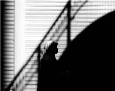  ??  ?? File photo shows an Indonesian woman walking along a street in the Causeway Bay district of Hong Kong on a Sunday when most of the city’s domestic helpers get the day off. — AFP photo