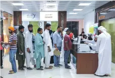  ?? Victor Besa / The National ?? People line up at the Tasheel centre at Al Raha Mall to take part in the amnesty, which has been extended