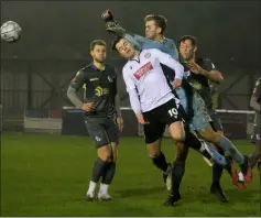  ?? Ref: 49-0120I ?? James Harding is clattered by Dartford keeper Ethan Wady