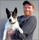  ?? Jonathan Bidwell ?? Artist Jonathan Bidwell (pictured with his dog, Buster, a Mountain Feist) will be painting a mural on the side of Courthouse Annex II in LaFayette beginning the end of May and ending sometime in July.