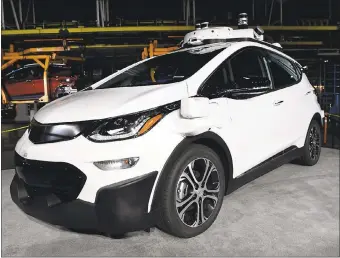  ?? JOSE JUAREZ — DETROIT NEWS FILE PHOTO VIA AP ?? A self-driving Chevrolet Bolt EV that is in General Motors’ autonomous vehicle developmen­t program appears on display at GM’s Orion Assembly in Lake Orion, Michigan.