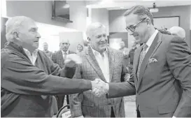  ?? Eric Gay / Associated Press ?? Chris Del Conte, right, would like to get Texas’ football program back to the glory days of former athletic director DeLoss Dodds, left, and coach Mack Brown.