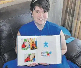  ?? ADAM MACINNIS/THE NEWS ?? Chelsea Pettipas holds her adventure book where she documents what’s happening in her life. She has autism spectrum disorder and battles mental illness and has spoken out on the need for better mental health care in Pictou County.