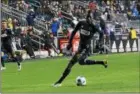  ?? MIKEY REEVES — FOR DIGITAL FIRST MEDIA ?? The Union’s Corey Burke sizes up a cross during the second half of a 2-0 win over New England Saturday.