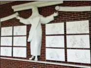  ?? CHRISTINA L. MYERS — ASSOCIATED PRESS ?? A statue of Jesus and reliefs are seen at Red Bank Baptist Church in Lexington, S.C., on Wednesday. The church wants to remove the art , saying it appears to send a Catholic message.