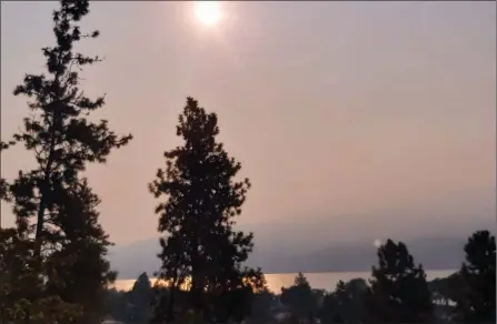  ?? RON SEYMOUR/ Special to The Herald ?? Okanagan Lake was hard to see, Tuesday morning, due to smoke which blew into the valley from several American states.