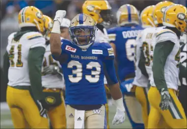  ?? The Canadian Press ?? Winnipeg Blue Bombers running back Andrew Harris (33) celebrates his first-down run against the Edmonton Eskimos during CFL playoff action in Winnipeg on Nov. 12, 2017. The two teams meet again tonight to kick off the regular season.