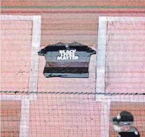  ?? AP ?? A ‘Black Lives Matter' shirt remains after the Mets and Marlins left the field.