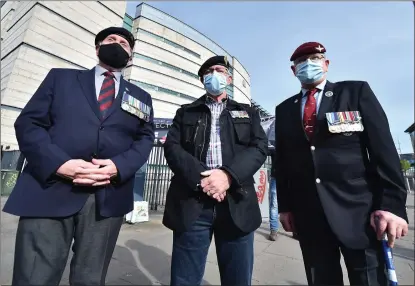  ?? Picture: Charles Mcquillan/getty ?? Military veterans and supporters outside court as the trial begins of two former British paratroope­rs charged with the murder of Official IRA man Joe Mccann at Belfast Laganside Courts