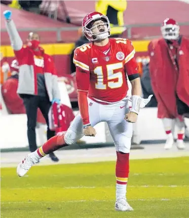  ?? JEFF ROBERSON/AP ?? Kansas City Chiefs quarterbac­k Patrick Mahomes celebrates after throwing a 5-yard touchdown pass to tight end Travis Kelce during the second half of the AFC championsh­ip NFL football game against the Buffalo Bills, Jan. 24 in Kansas City, Mo.