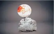  ??  ?? Studio Greytak has designed a Jupiter lamp out of the mineral aragonite, depicting the whirling, turbulent gases of the planet.