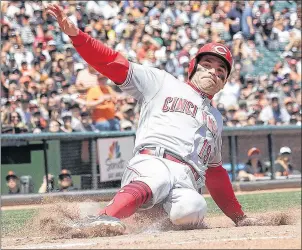  ?? AP PHOTO ?? Cincinnati Reds’ Joey Votto scores against the San Francisco Giants during the fifth inning of a game in San Francisco on Wednesday.