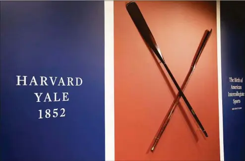  ?? John Minchillo / Associated Press ?? The Harvard-Yale Regatta 1852 trophy oars are displayed before an auction on Thursday at Sotheby’s in Manhattan.