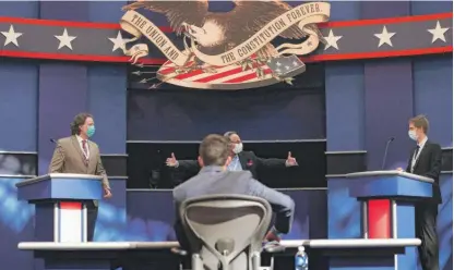  ?? WIN MCNAMEE/GETTY IMAGES ?? Students Blake Wiseman (left) and Christophe­r Heermann, stand-ins for President Donald Trump and Democrat Joe Biden, respective­ly, participat­e Monday in a rehearsal for the debate at Case Western Reserve University and the Cleveland Clinic.