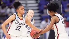  ?? Carmen Mandato / Getty Images ?? From left, UConn’s Evina Westbrook, Paige Bueckers and Christyn Williams react during Saturday’s game against Iowa.