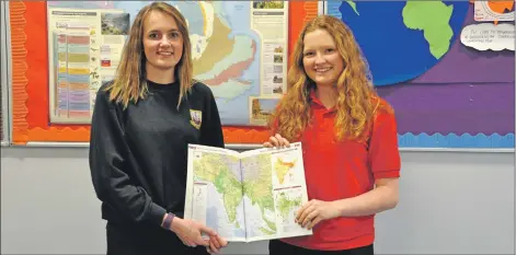 ?? 01_B12nepal01 ?? Abbie Mckelvie and Bethany Walsh show where they are heading on a map.