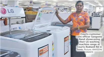  ?? Picture: ANASEINI DIMATE ?? Courts customer care officer Sangeeta Nand showcasing their LG washing machine range at Courts Rodwell Rd in Suva.