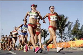  ?? Julian Finney Getty Images ?? RACEWALKER María Guadalupe González of Mexico, left, won a silver in the 20-kilometer race at the 2016 Olympics, but she is not in Tokyo after being banned for doping. Mexico has been a force in the sport.