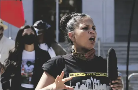  ?? AP PHOTO/RICHARD VOGEL ?? In this 2020 file photo, Melina Abdullah speaks during a Black Lives Matter protest at the Hall of Justice in downtown Los Angeles.