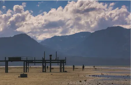  ?? George Rose / Getty Images ?? Lake Tahoe, which is 9.1 feet from full, has some large areas by piers and boat ramps where the lake bed is exposed.