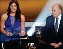  ??  ?? Ceremony: Hope Solo and Sepp Blatter in 2013