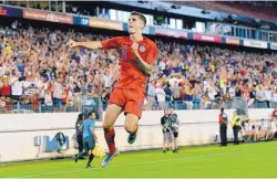  ?? MARK ZALESKI/ASSOCIATED PRESS ?? United States midfielder Christian Pulisic celebrates after scoring a secondgoal against Jamaica earlier this week in the Gold Cup semifinals.