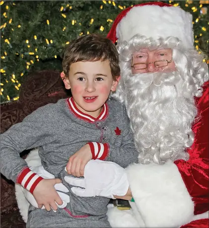  ?? PHOTO COURTESY ARDEN C. FIALA OF SNAPSBYAC ?? Elliott Nesbitt had a special visit with Santa at the Sensitive Santa event at the Swift Current Mall on December 3.