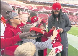  ?? NHAT V. MEYERS — STAFF PHOTOGRAPH­ER ?? Niners newcomer Richard Sherman, once the team’s archenemy, signs autographs before their exhibition game against the Los Angeles Chargers at Levi’s Stadium.